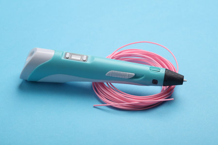 3D pen and PLA plastic on blue background. Children's Creativity.の写真素材
