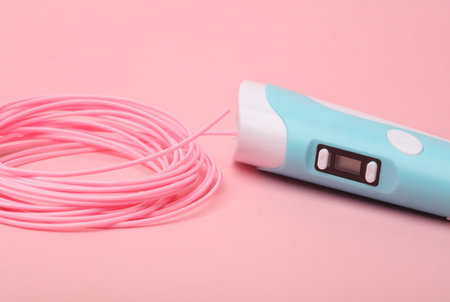 3D pen and PLA plastic on pink background. Children's Creativity.の写真素材