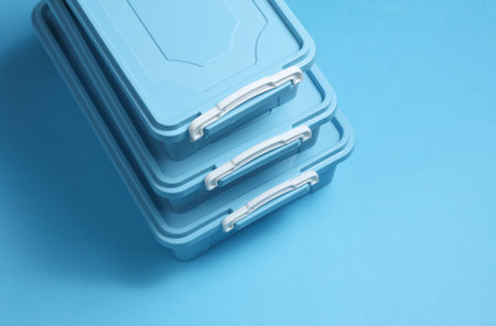 Blue Plastic containers for storing food on blue background. Top viewの写真素材