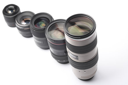 Set of Professional photographic or videographic lenses on white background. Photographer's equipmentの写真素材