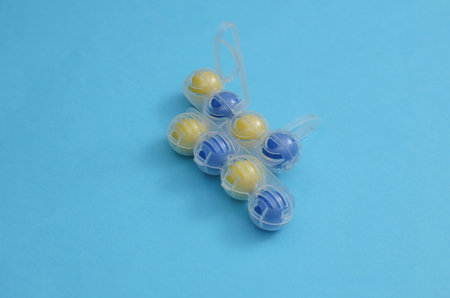 Toilet rim block cleaners on blue background. Top view