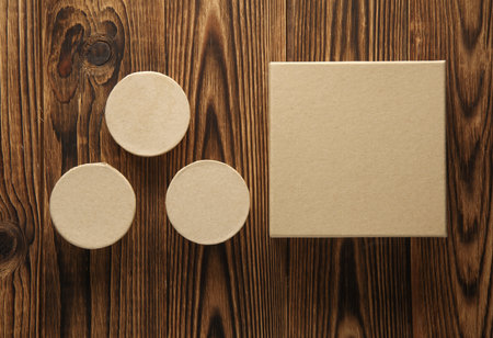 Kraft cardboard boxes on a wooden backgroundの写真素材