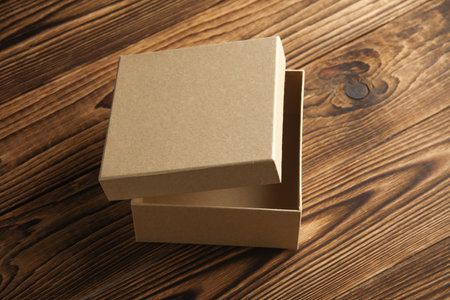 Kraft cardboard box on a wooden background