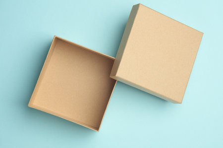 Kraft cardboard box on blue backgroundの写真素材