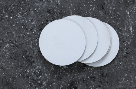 White round empty coasters Mockup on dark concrete background