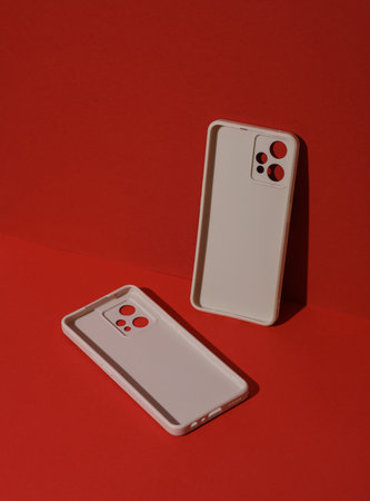 White Protective cases for smartphones on red background