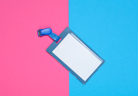 ID badge on pink blue background. Top viewの写真素材
