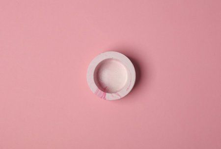 Plaster tray on a pink background. Stands for candlesの写真素材
