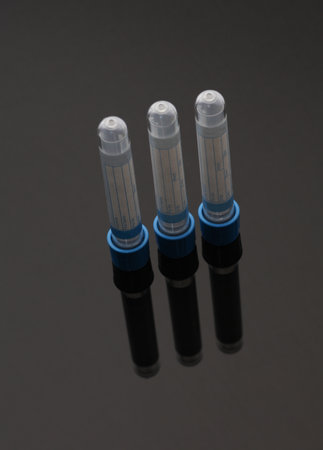 Test tubes on a black background close up