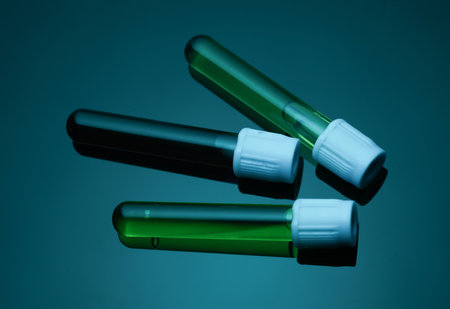 Test tubes with colored liquids in blue neon light