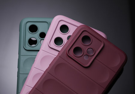 Smartphone protective covers on black backgroundの写真素材