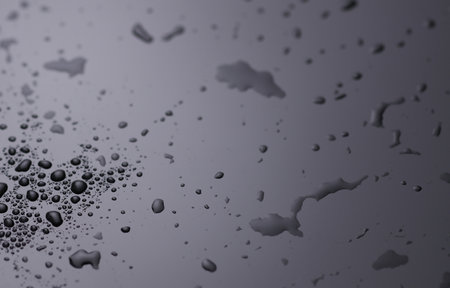 Drops of water on a black surfaceの写真素材