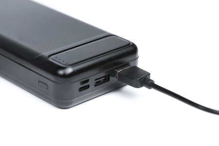 Black external battery power bank on a white background