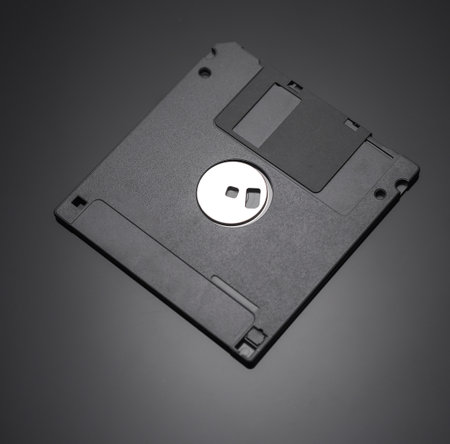 Black Floppy disk on dark backgroundの写真素材