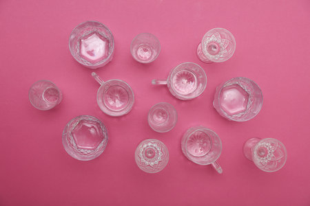 Drink glasses on pink background. Top view. Minimalism, creative layout
