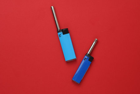 Lighters on red background. Top view