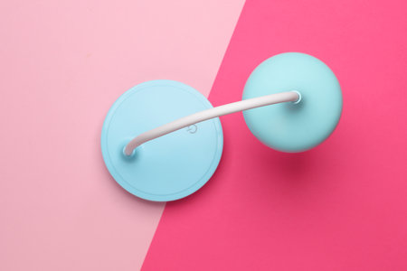 Desktop flexible LED lamp on a pink background. Top viewの写真素材