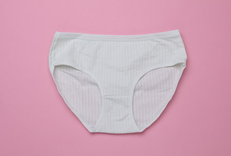 Women's comfortable panties on pink pastel background
