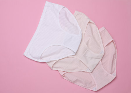 Set of Women's comfortable panties on pink pastel backgroundの写真素材
