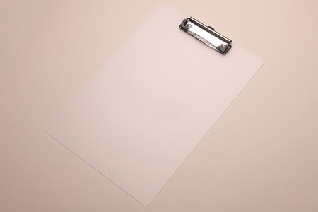 Plastic clipboard on beige background close upの写真素材