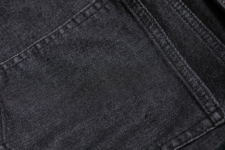 Back pocket of dark gray jeansの写真素材
