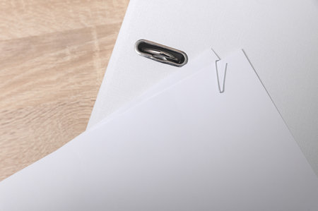 White blank sheets of paper with a paper clip on folderの写真素材