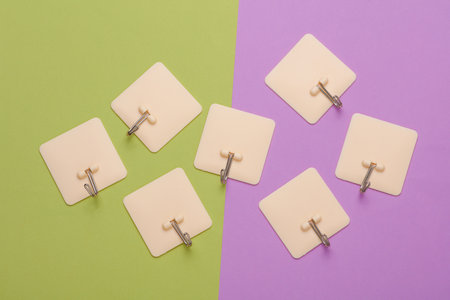 Wall hooks on a green purple backgroundの写真素材