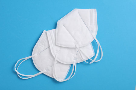 kn95 medical masks on a blue background. Top view