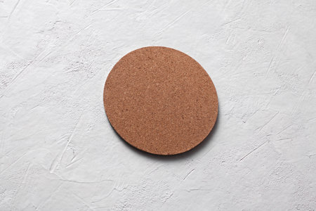 Cork coasters for drinks on white concrete backgroundの写真素材