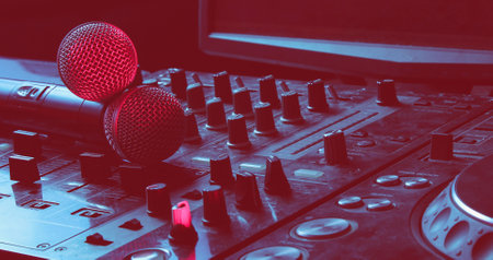 Night club, nightlife concept. Disco. Two microphone on DJ controller. Duotone effect