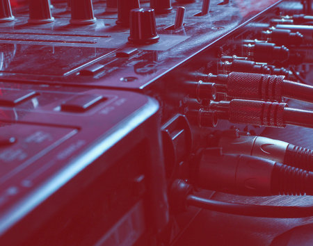 Night club concept. Audio mixer with wires close up. Duotone effectの写真素材