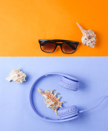 Summer rest concept. Headphones, sunglasses, shells on orange-blue background. Beach music. Top...