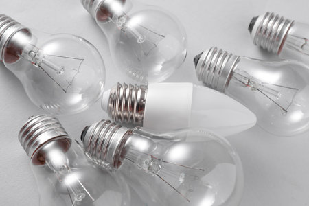 LED and ncandescent light bulbs on gray background. Energy saving