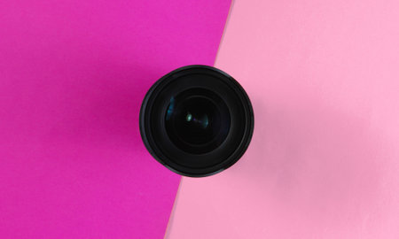 Lens on a colored paper background.