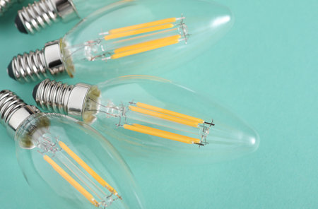 Energy Saving Filament Light Bulbs on Mint Green Background