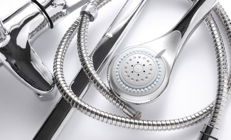 Parts of disassembled bathtub faucet with shower on white backgroundの写真素材