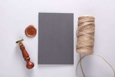 Invitation Card with wax seals and vintage stamp, thread on gray background. DIY, Gift certificate, wedding invitation. Flat layの写真素材