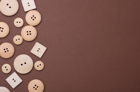 Set of Wooden buttons on a brown background. Copy space