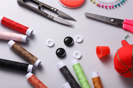 Tailor sewing accessories on gray background. Top viewの写真素材