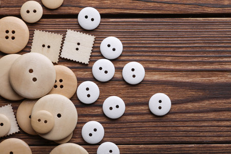 Wooden buttons on a wooden backgroundの写真素材