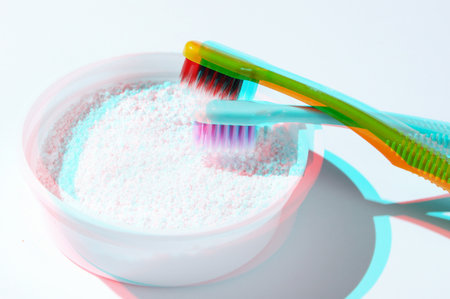 Two toothbrushes, tooth powder on white background. Minimalism oral hygiene concept. Glitch effectの写真素材
