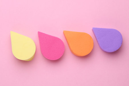 Colored Makeup Sponges on Pink Backgroundの写真素材