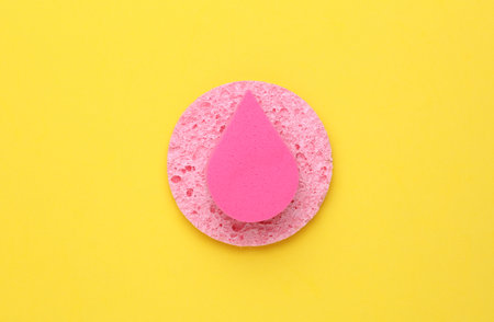 Pink Makeup Sponges on yellow Backgroundの写真素材