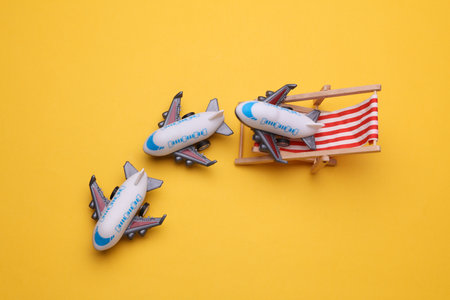 Airplane on deck chair. Travel conceptの写真素材