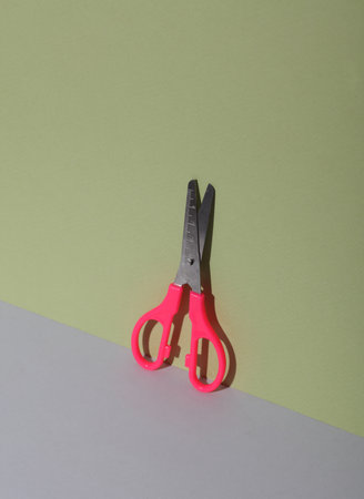 Scissors on a green gray background