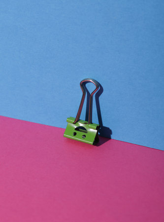 Binder clip with a smiling face.
