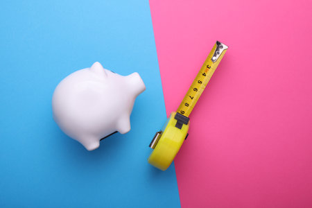 Ceramic white piggy bank. Conceptual photo. Top view. Flat layの写真素材