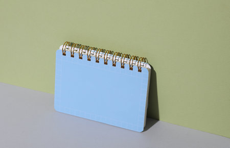 Blue notebook on a green background