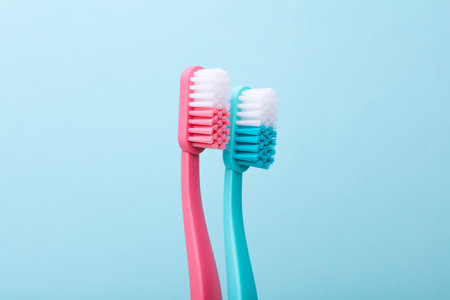 Plastic toothbrushes on blue background close upの写真素材