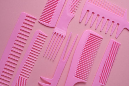 Set of plastic combs on pink background.の写真素材